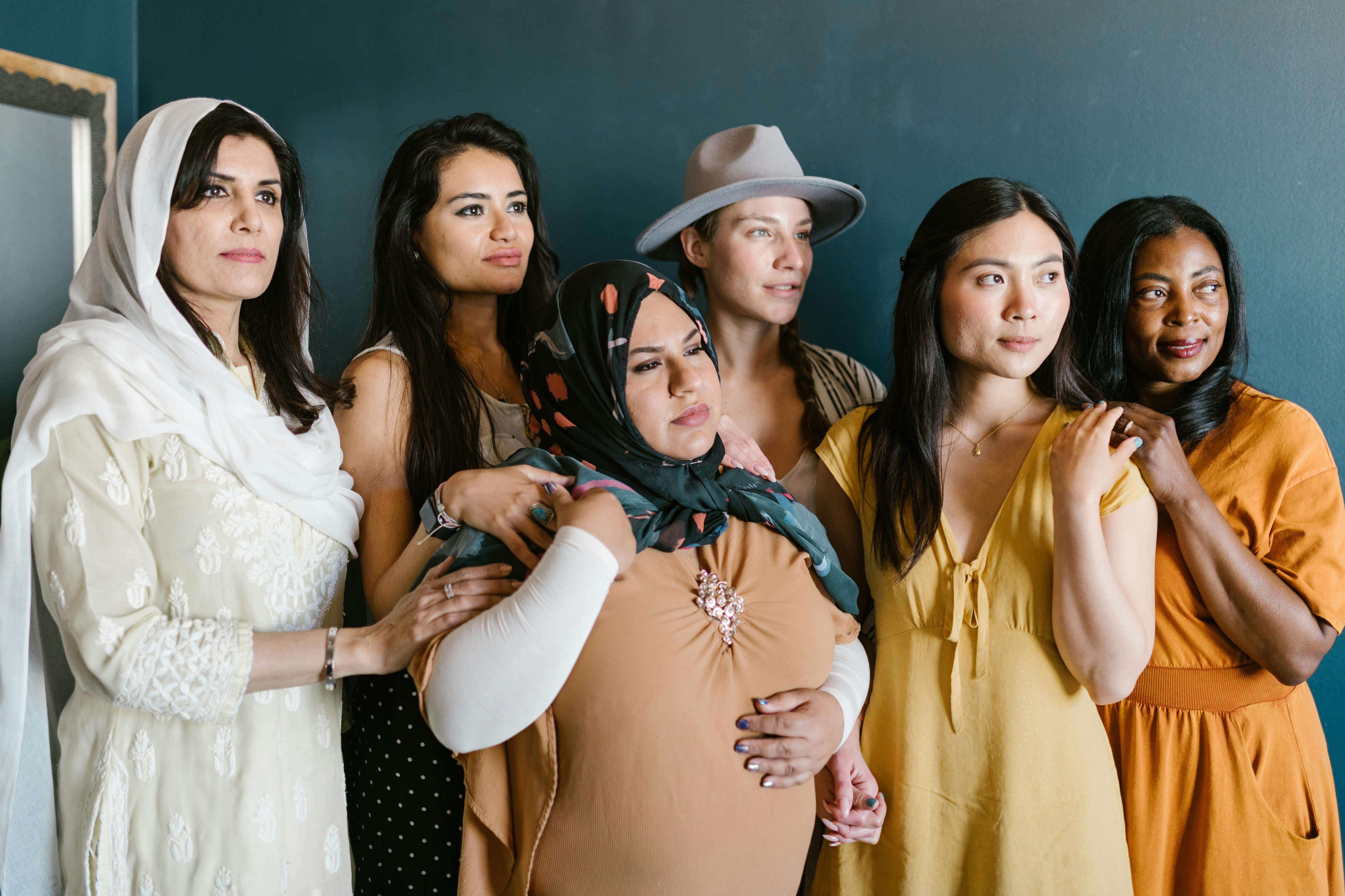 Group of diverse women looking off to distance.