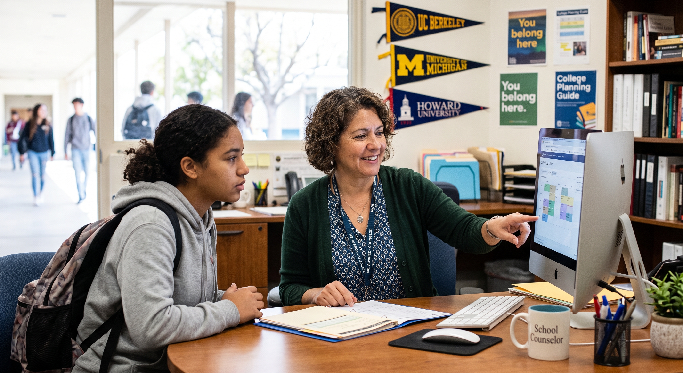 a counselor in a school environment by a computer